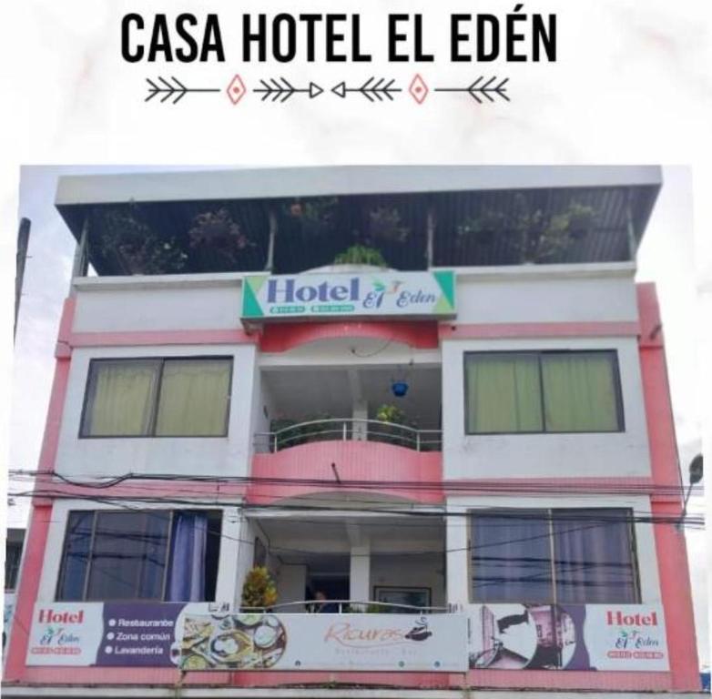 a casa hotel el eden sign on the side of a building at Casa Hotel El Eden in Carepa