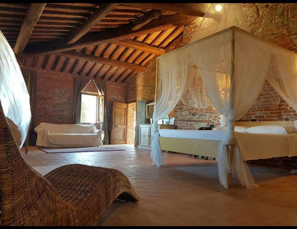 Postel nebo postele na pokoji v ubytování Morami Wine Agriturismo