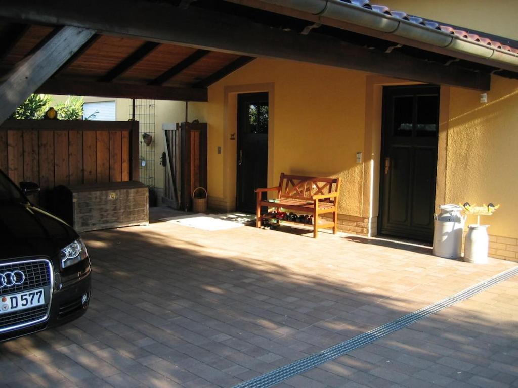 a car parked in front of a house at Carol's Country-House in Seehof