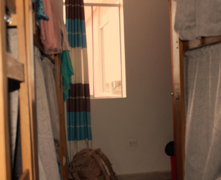 Ένα ή περισσότερα κρεβάτια σε δωμάτιο στο Mariandes Hostel