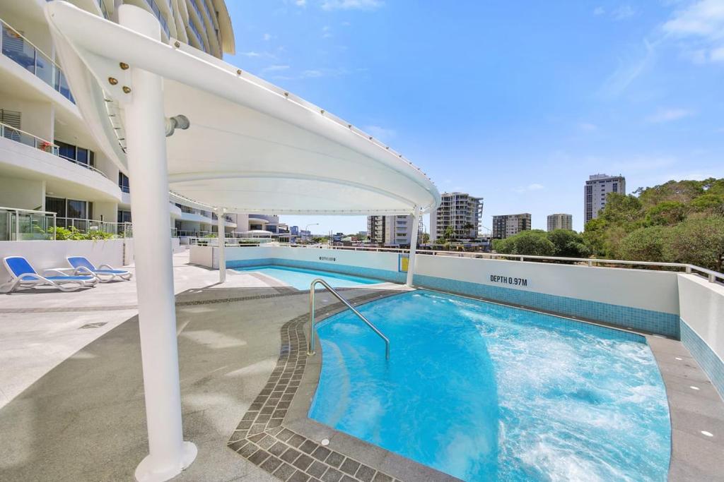 a swimming pool on the roof of a building at Poolside Bliss in Maroochydore