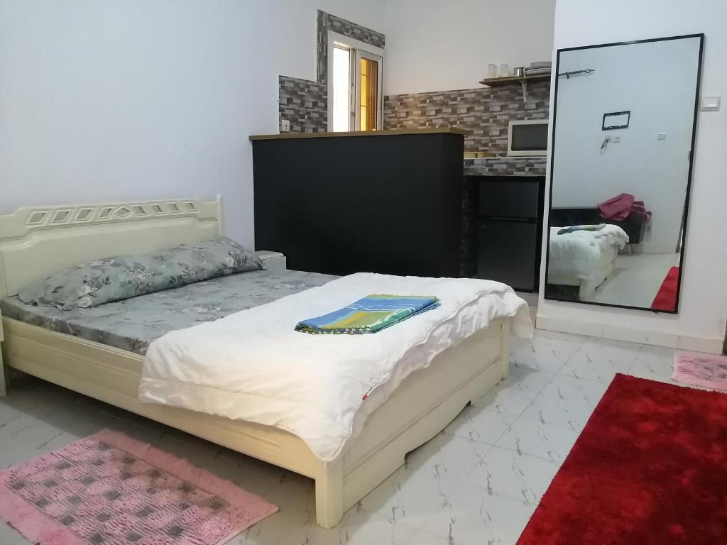 Ένα ή περισσότερα κρεβάτια σε δωμάτιο στο Résidence hibis chez M&B