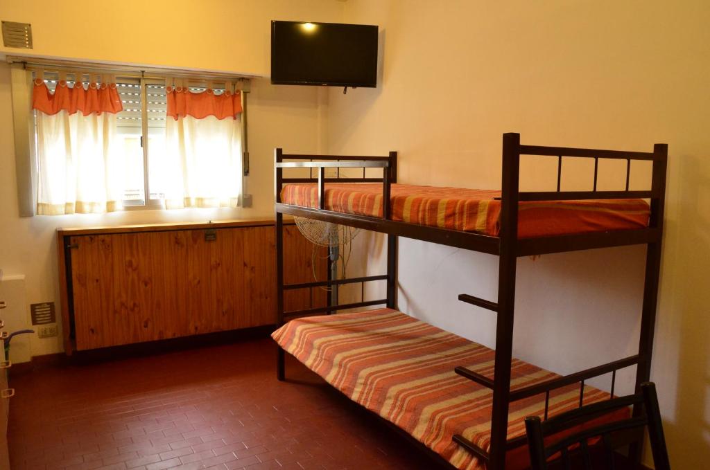 Ένα ή περισσότερα κρεβάτια σε δωμάτιο στο Lo de Carlos