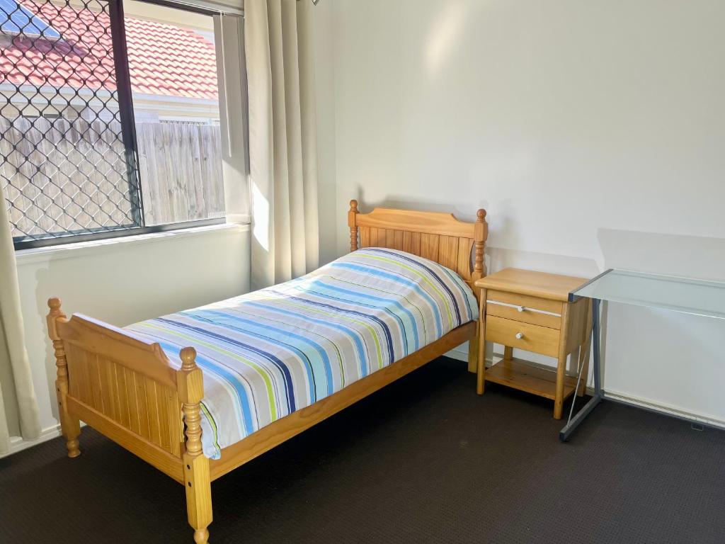 Ένα ή περισσότερα κρεβάτια σε δωμάτιο στο Private Room with shared bathroom