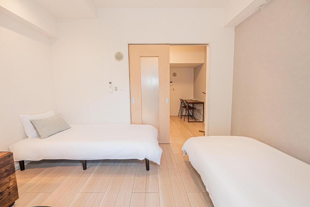 Ένα ή περισσότερα κρεβάτια σε δωμάτιο στο Louis stage asakusa