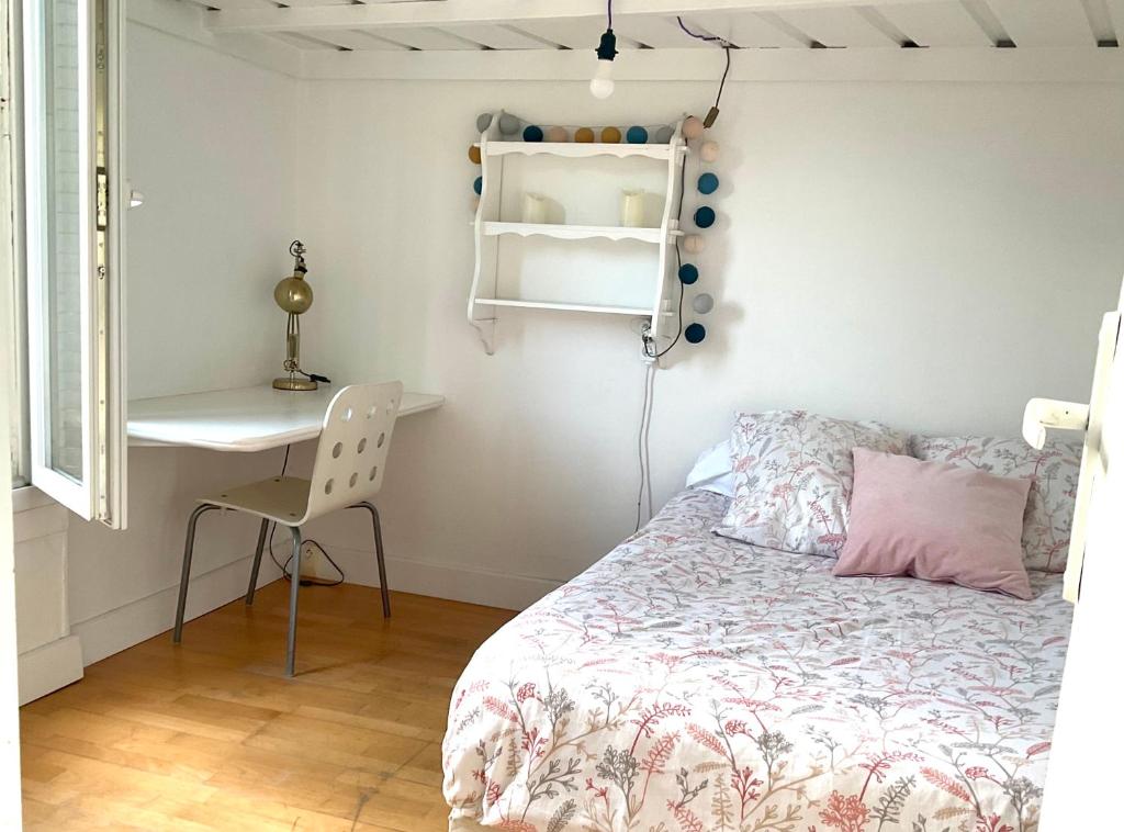 Postel nebo postele na pokoji v ubytování Appartement calme avec jardin