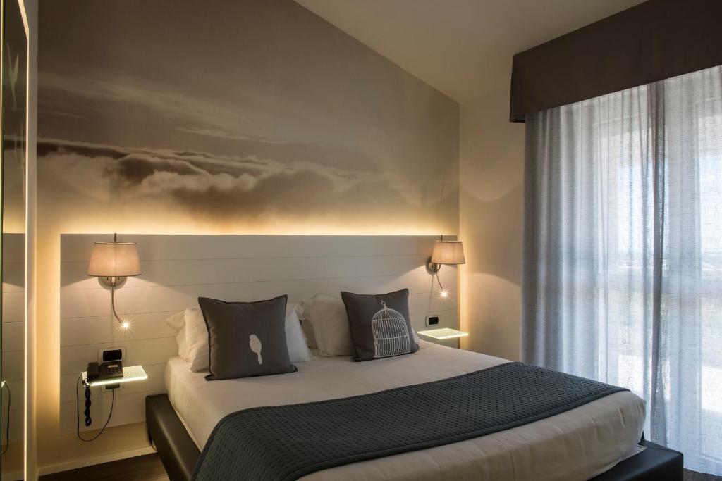 Postel nebo postele na pokoji v ubytování Ariae Dépendance - Alihotels