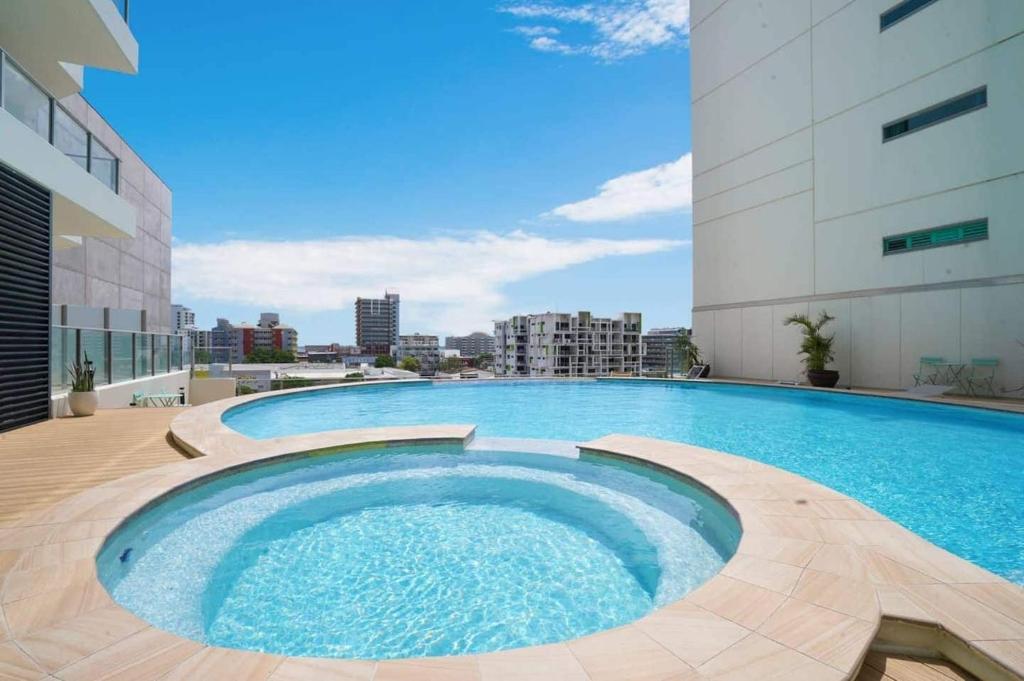 a large swimming pool on top of a building at Darwin City Centre Studio Pool, Gym & Parking in Darwin