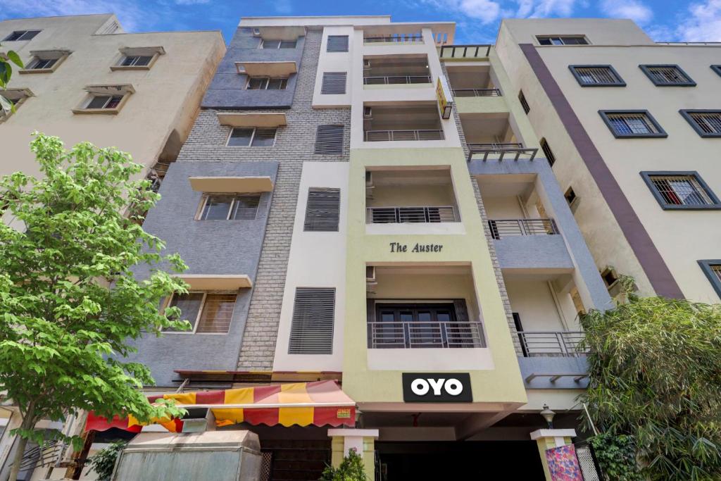 an apartment building with an ovo sign on it at Collection O Hyderabad Hitech City Formerly Night Eye in Hyderabad