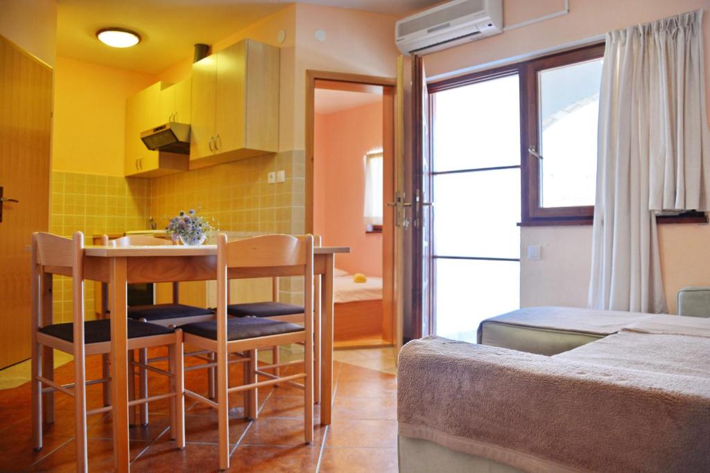 Posteľ alebo postele v izbe v ubytovaní Apartments Joza