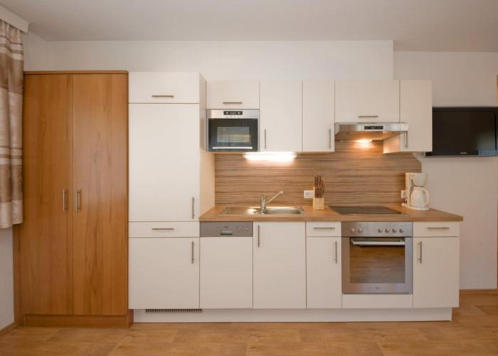 Kuchyň nebo kuchyňský kout v ubytování Apart Alexandra