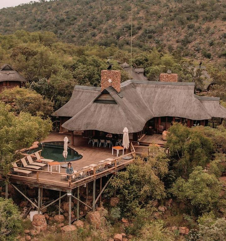 an image of a house with a swimming pool at Tshwene Lodge in Vaalwater