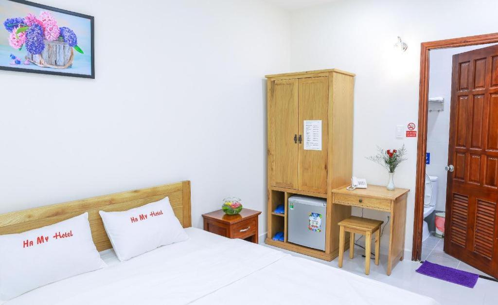 Postel nebo postele na pokoji v ubytování Ha My Hotel