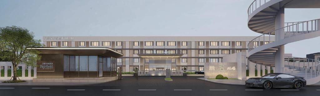 un coche aparcado delante de un edificio en Fairfield by Marriott Beijing Capital Airport, en Beijing