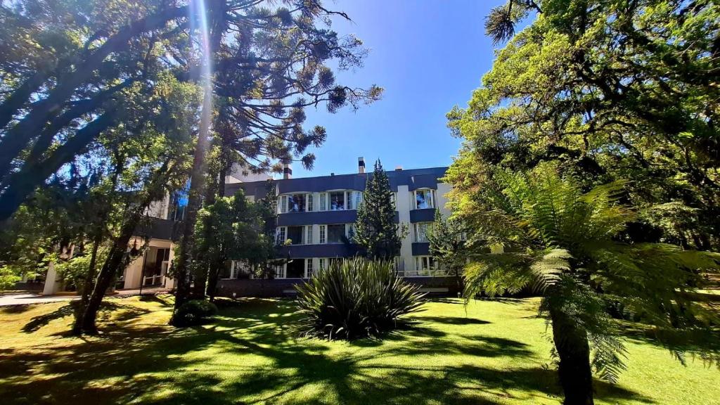 a building with a lot of trees in front of it at Privilege Apart hotel Mountain Village in Canela