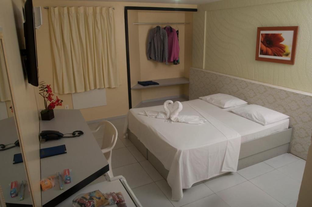 Cama ou camas em um quarto em JR Hotel