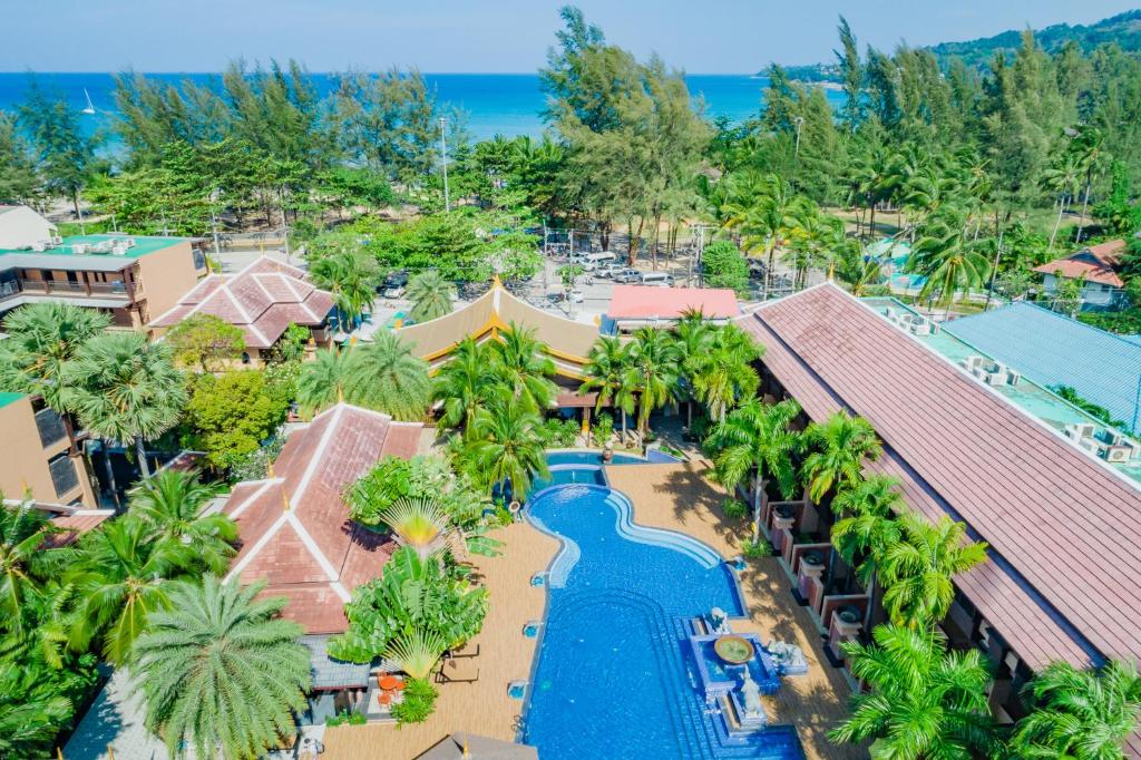 an aerial view of a resort with a swimming pool at Princess Kamala Beachfront Hotel - SHA Extra Plus in Kamala Beach