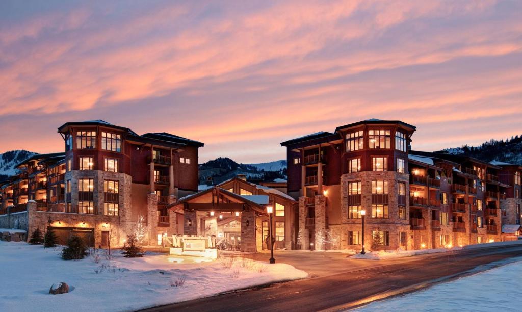 a lodge in the snow at sunset at Hilton Grand Vacations Club Sunrise Lodge Park City in Park City
