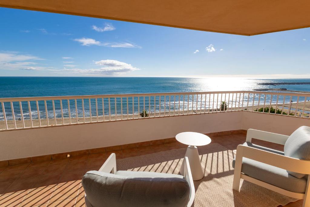 a living room with a view of the ocean at Apartamentos La Jabega in Fuengirola