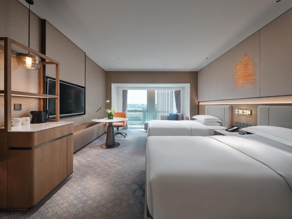 Ένα ή περισσότερα κρεβάτια σε δωμάτιο στο Crowne Plaza Hohhot City Center