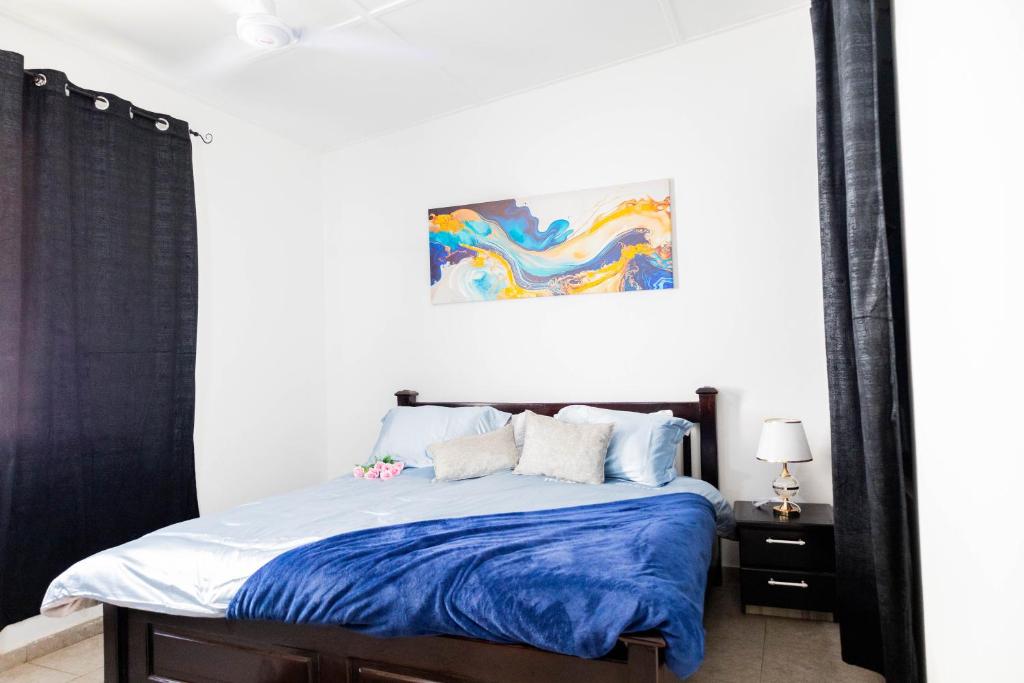 Ένα ή περισσότερα κρεβάτια σε δωμάτιο στο The Eli Villa