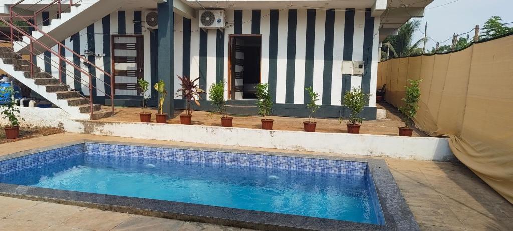 Πισίνα στο ή κοντά στο Sai Homestay