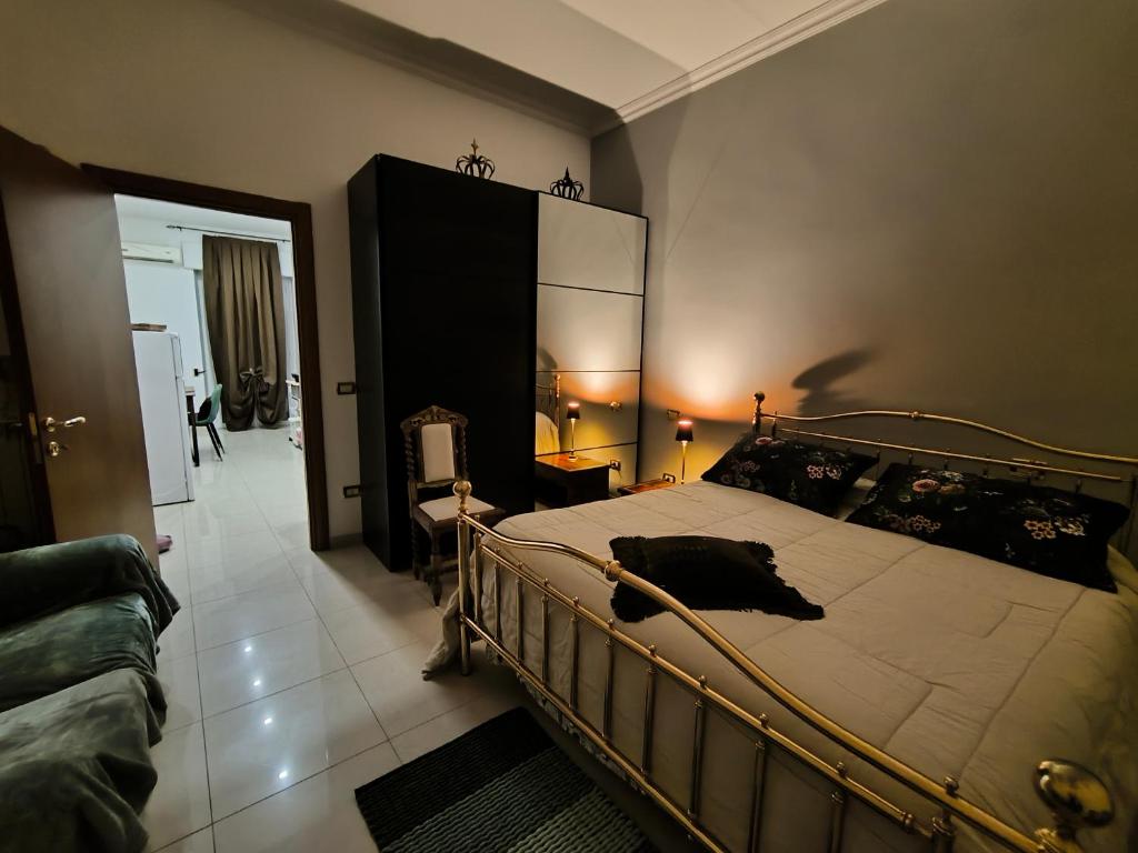 a bedroom with a large bed in a room at By Domy 2 Grottaglie in Grottaglie