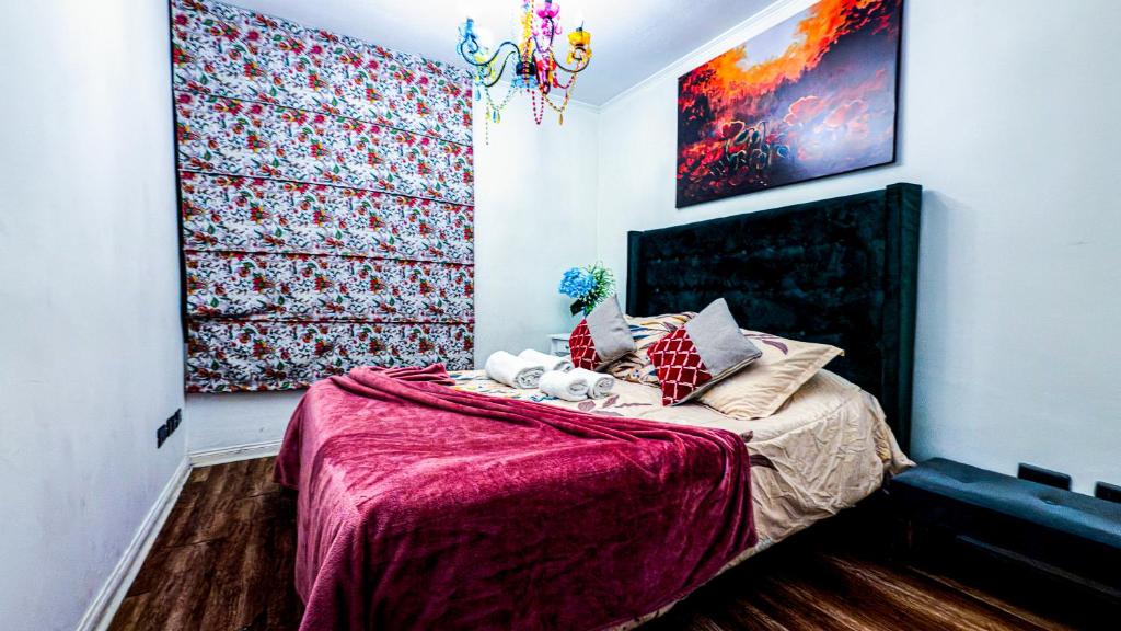 Postel nebo postele na pokoji v ubytování Santiago Centro 2 dormitorios check in tardío