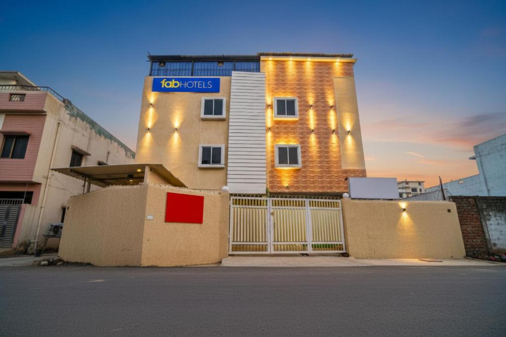 a building with a sign on the side of it at FabHotel Sonnet Inns in Rānchī
