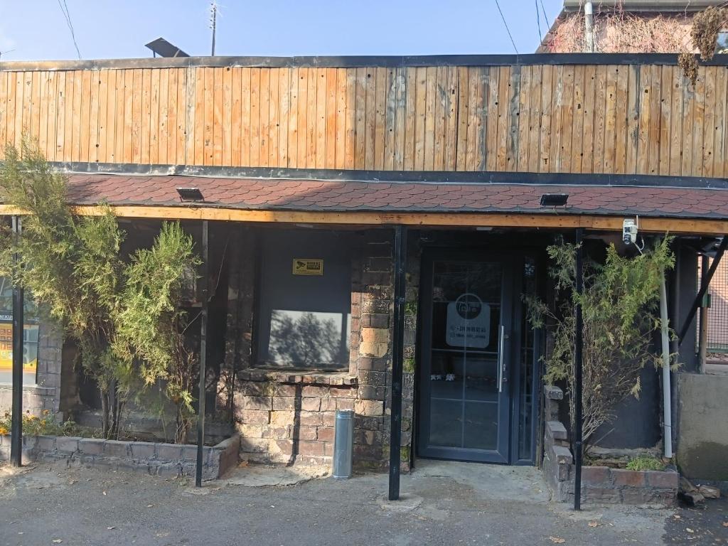 a building with a door and a sign on it at Tehran mets armenia in Yerevan