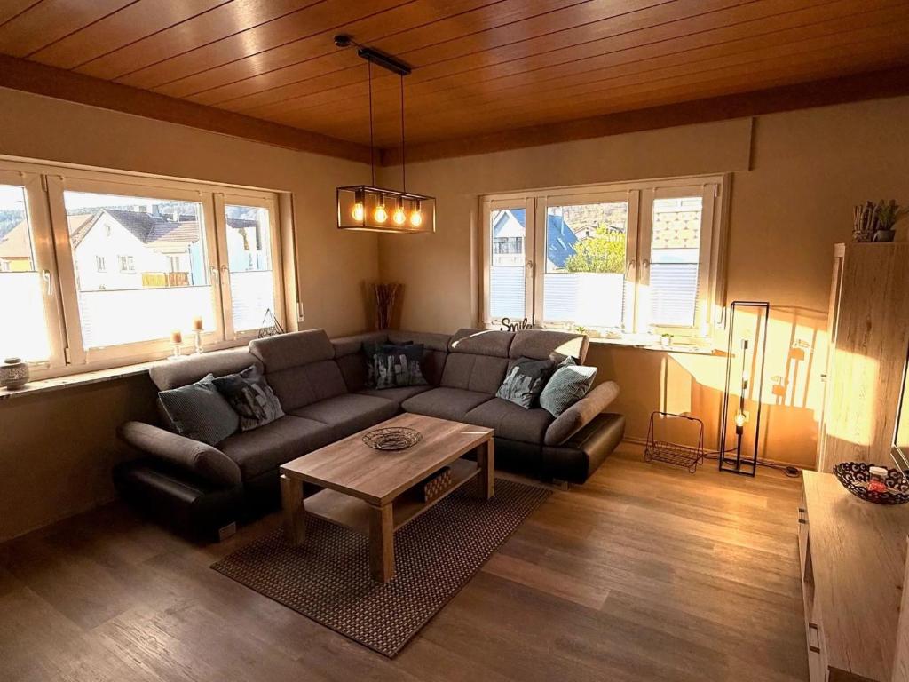 a living room with a couch and a table at Ferienwohnung Seus in Dorfprozelten