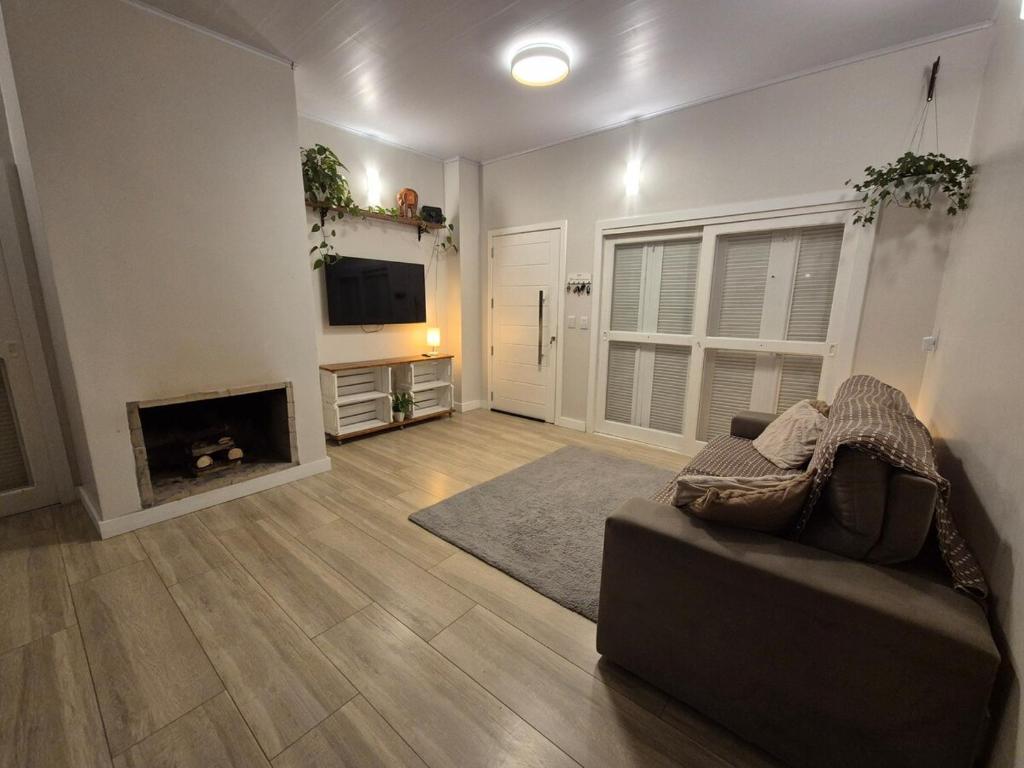 Et tv og/eller underholdning på Casa de temporada Capão da Canoa