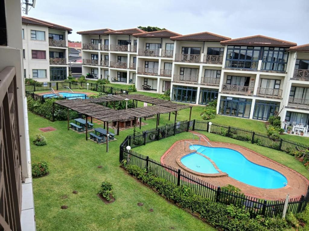 an aerial view of an apartment complex with a swimming pool at 54 Topanga Holiday Accommodation in Margate