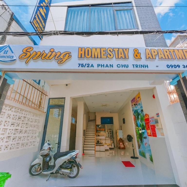 a scooter parked in the front of a store at Spring Homestay in Vung Tau