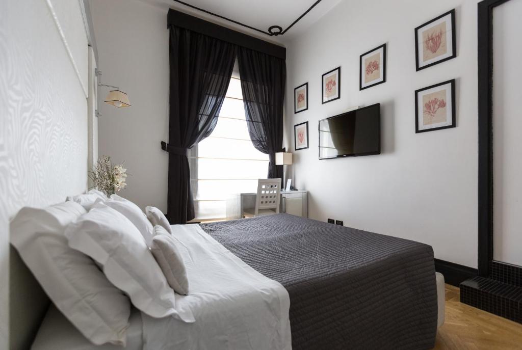 Postel nebo postele na pokoji v ubytování Residenza Scipioni Luxury B&B