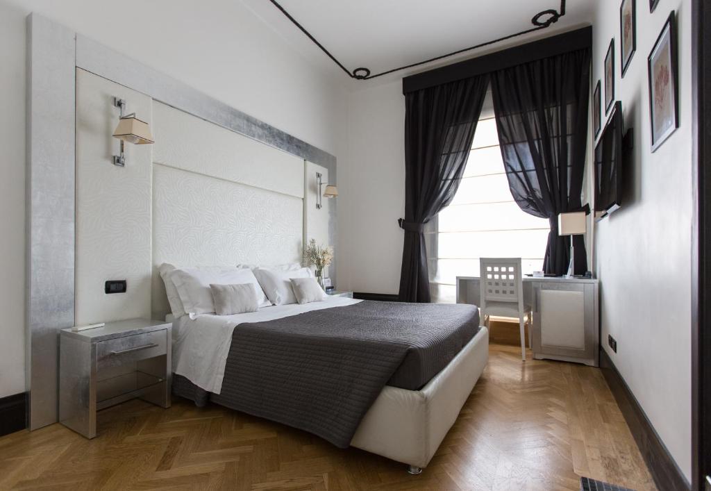 Postel nebo postele na pokoji v ubytování Residenza Scipioni Luxury B&B