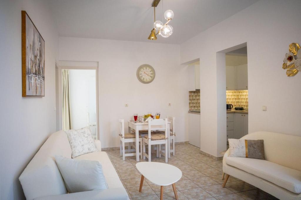 a living room with a couch and a table at Fotis House 3 in Afantou
