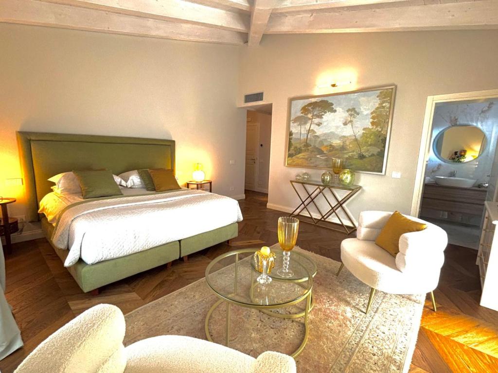 a bedroom with a bed and a table and chairs at My Maison 49 in Empoli