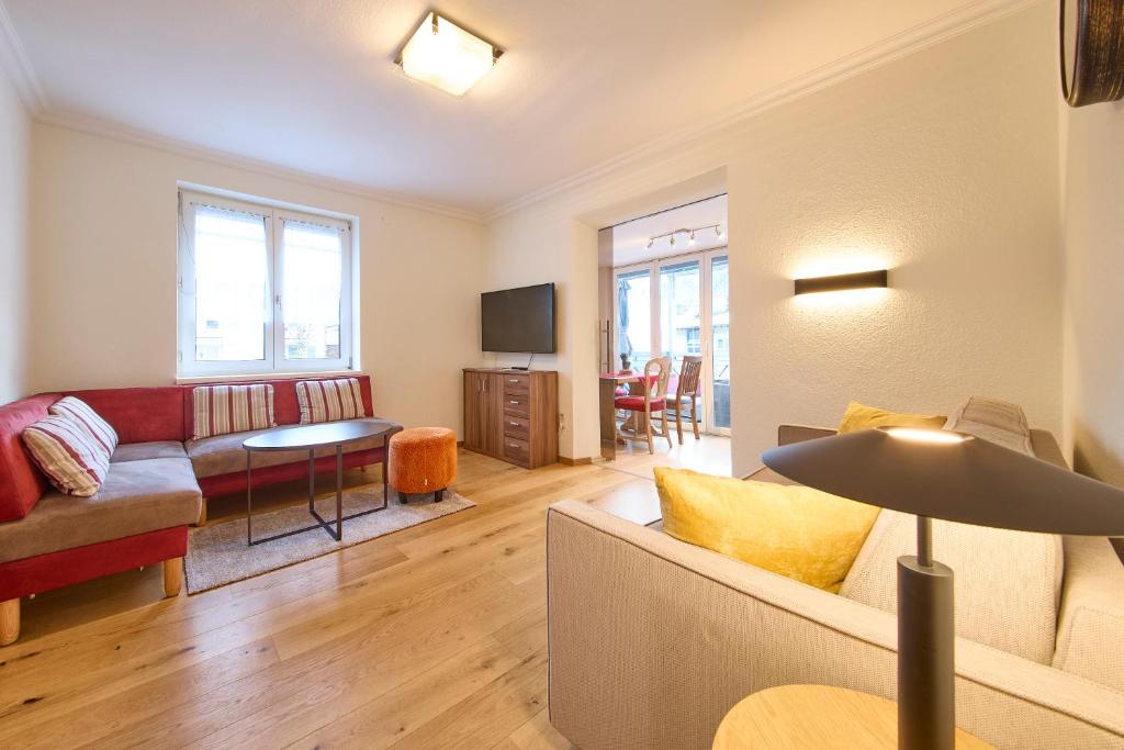 a living room with a couch and a table at Apartment Sandra in Schwarzach im Pongau