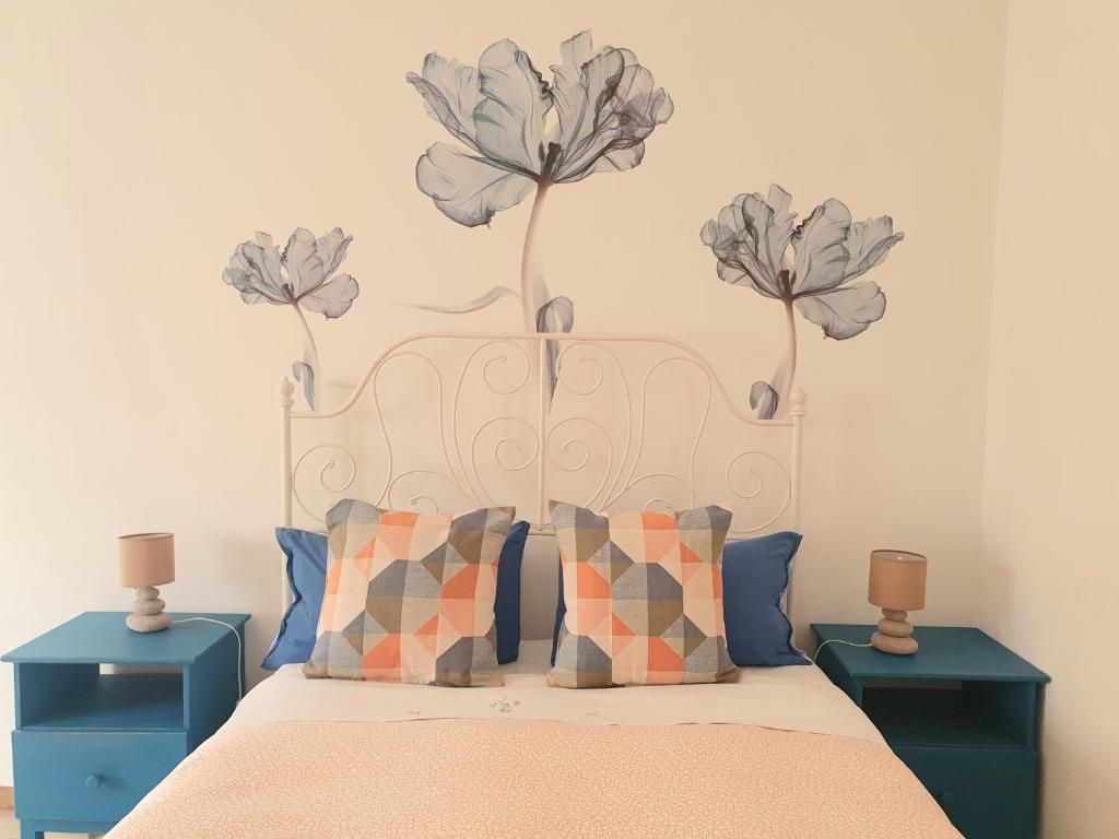 Una cama o camas en una habitación de Fiori e Frutti Guest Home