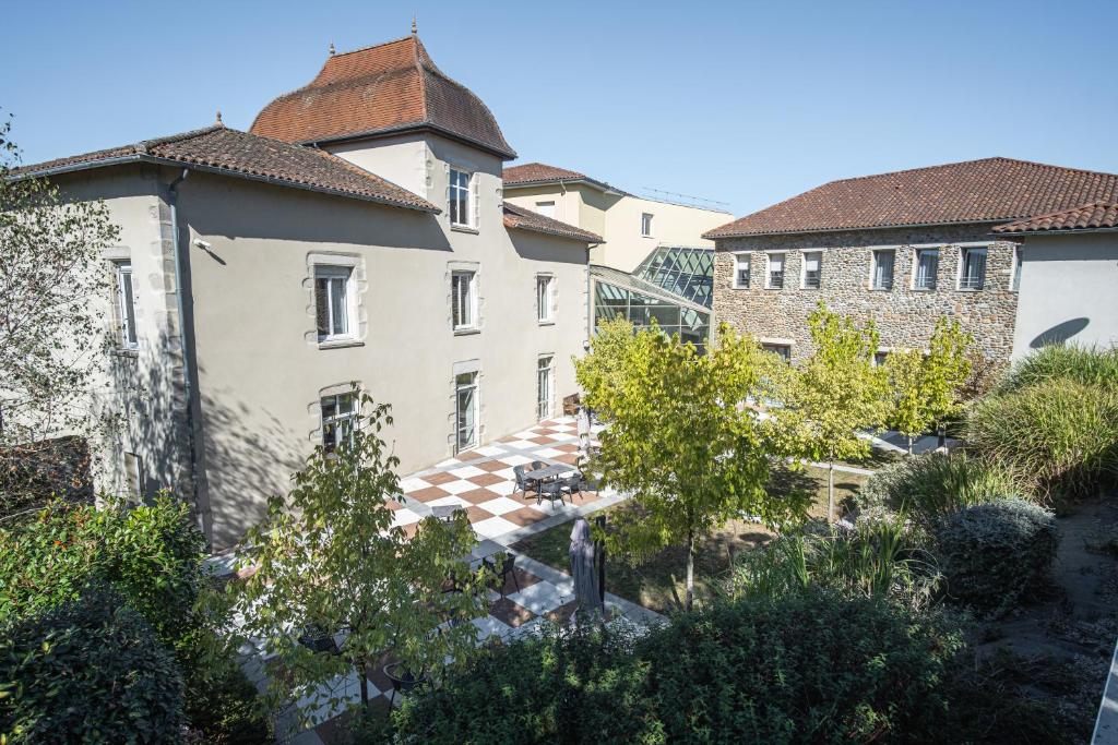 an aerial view of a building with trees and buildings at Domitys Les Châtaigniers in Panazol