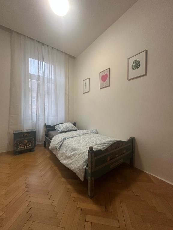 Ένα ή περισσότερα κρεβάτια σε δωμάτιο στο Lounge Piano Apartment