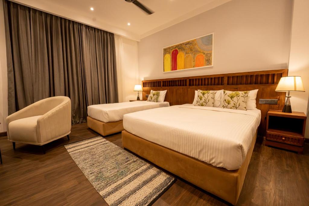 Ένα ή περισσότερα κρεβάτια σε δωμάτιο στο Oasia By Oasis Negombo