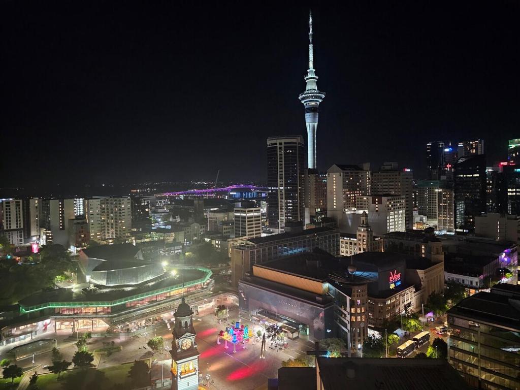 a view of a city at night with the space needle at Great Apartment with City Viewsclose to Everything in Auckland