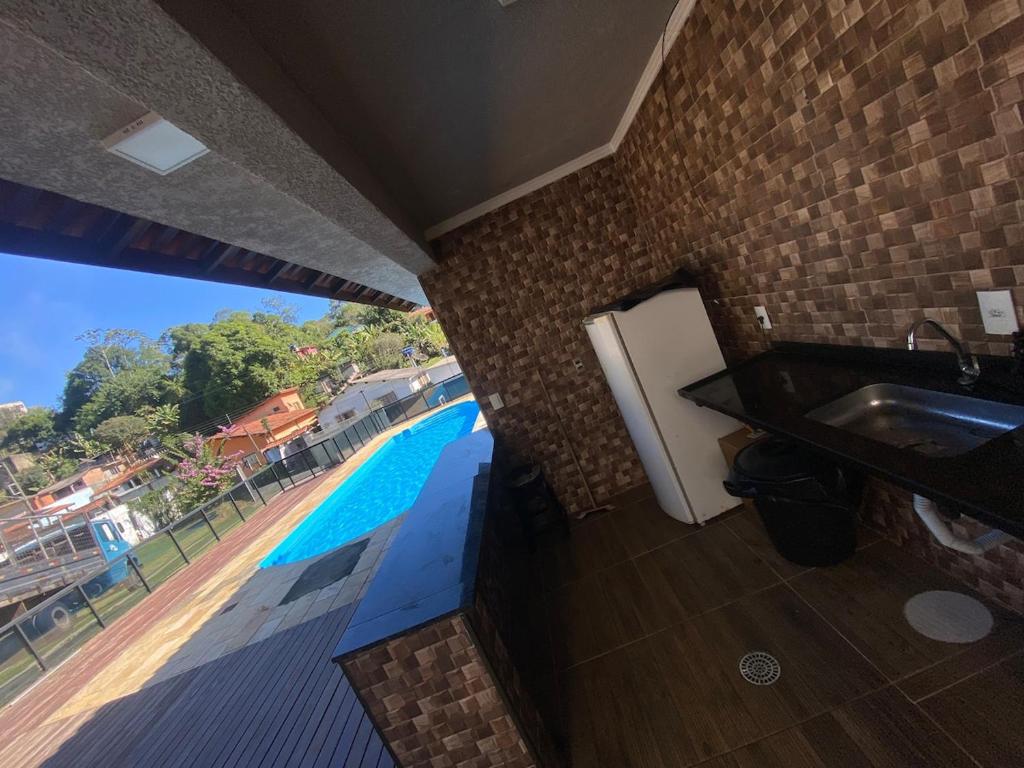 Бассейн в Chácara da Sol 10 pessoas или поблизости