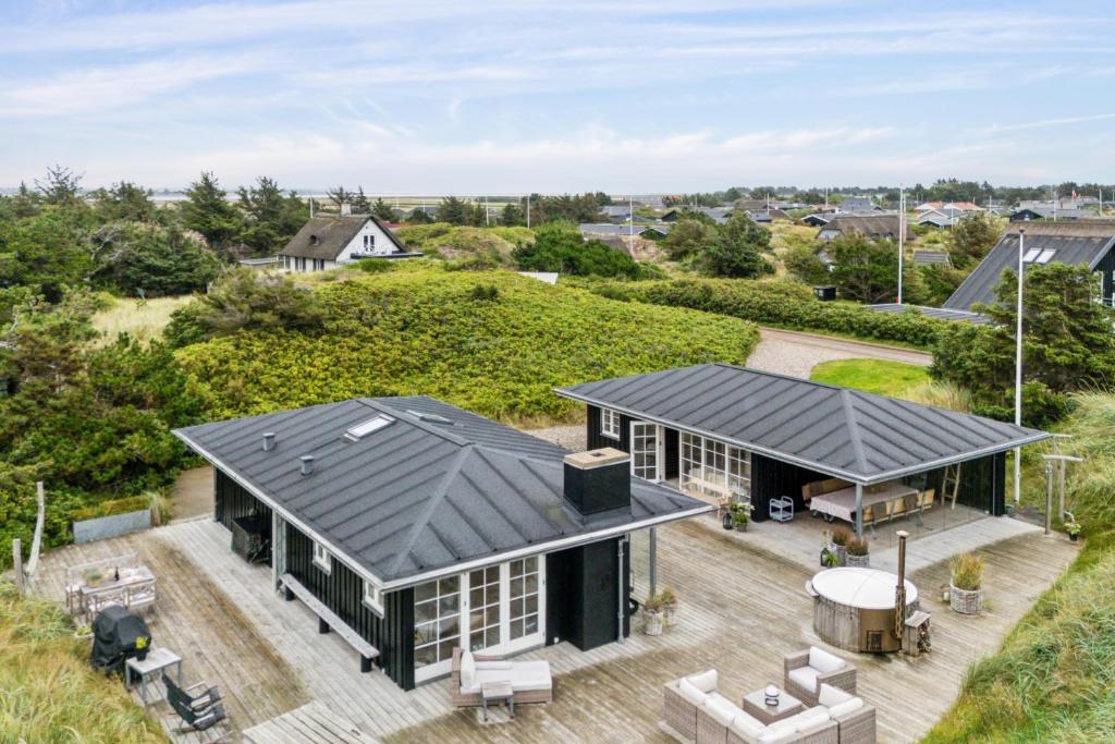 an aerial view of a house with a black roof at Feriehus 1142 in Ringkøbing