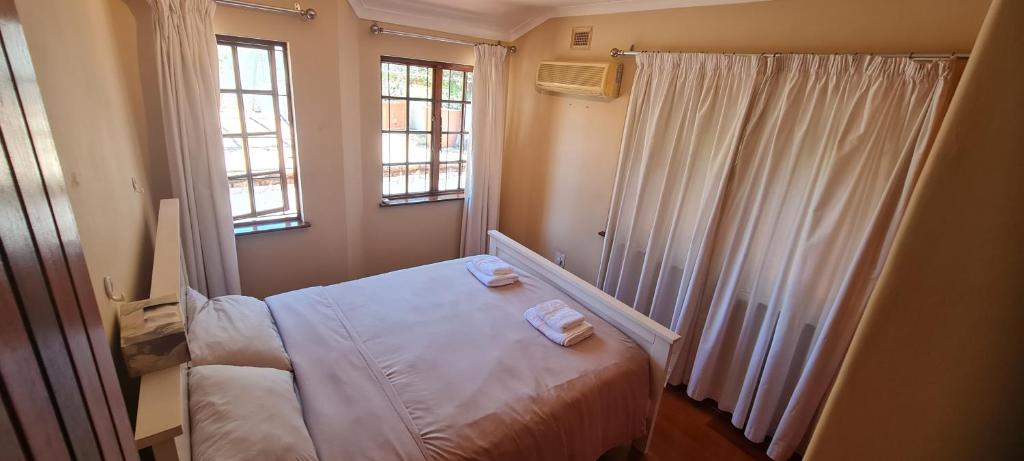 En eller flere senge i et værelse på Tranquility on Musgrave