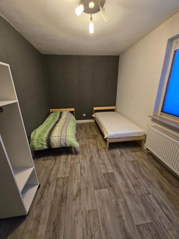 Ένα ή περισσότερα κρεβάτια σε δωμάτιο στο Waldkappel Bergblick