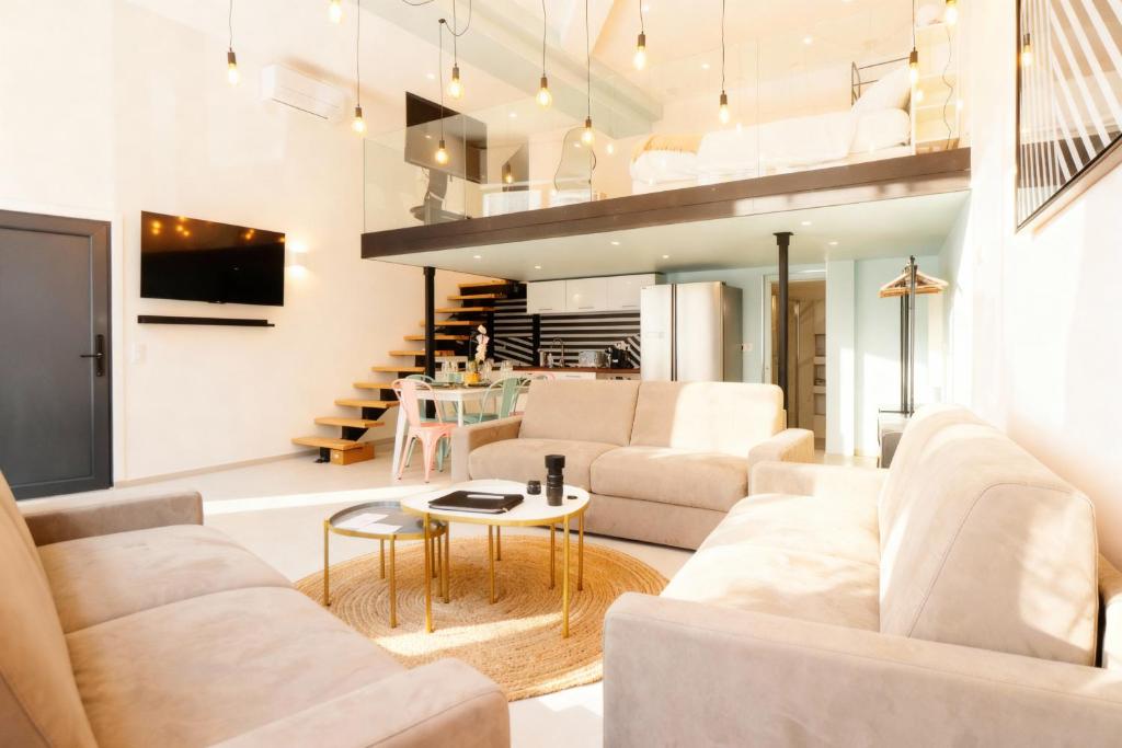 a living room with two white couches and a table at VILLA MARINA CANNES in Cannes