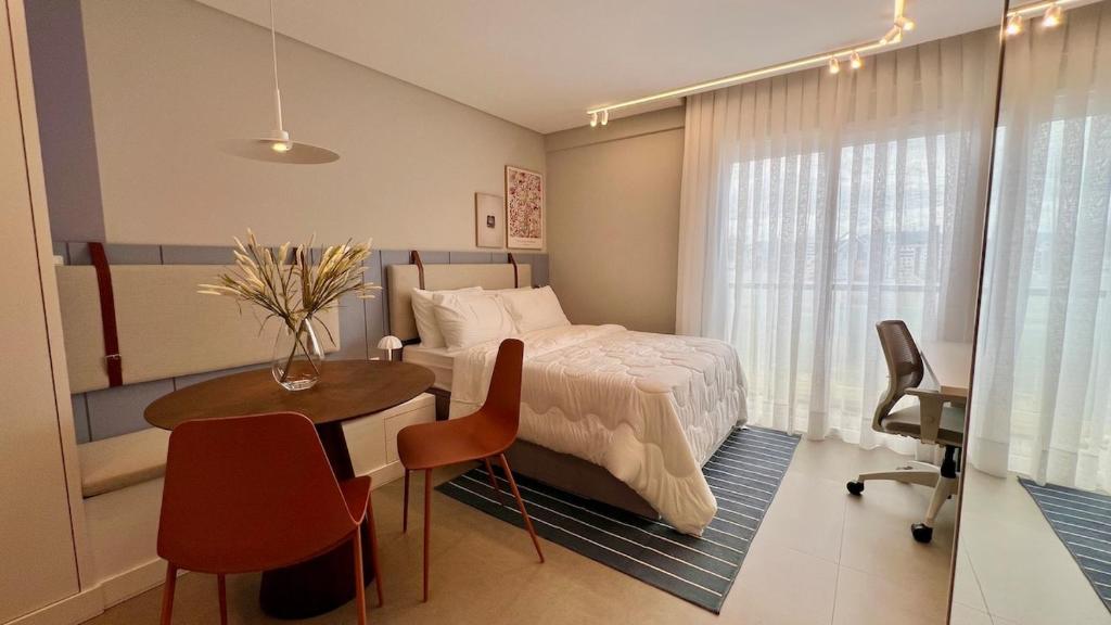 En eller flere senge i et værelse på Studio Moderno na Velha, perto da Vila Germânica